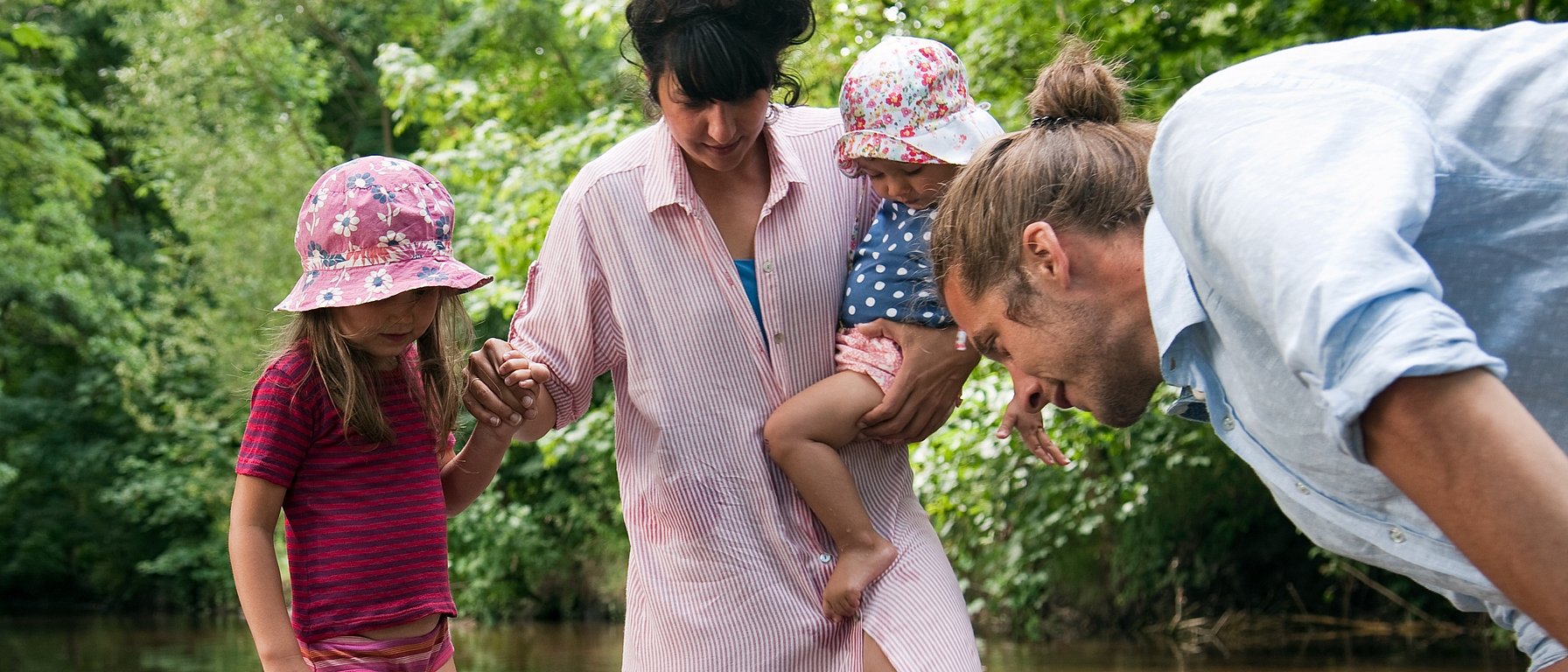 family looking at water