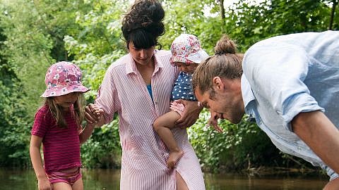 family looking at water