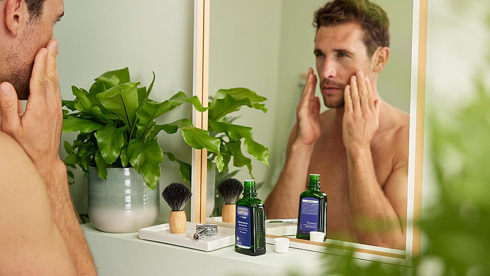 man applying after shave