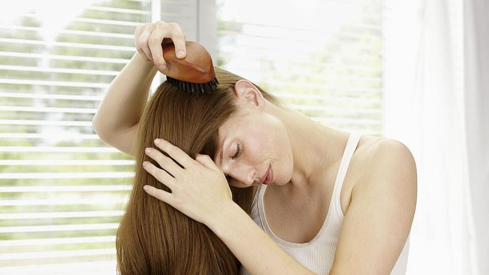 woman combing hair